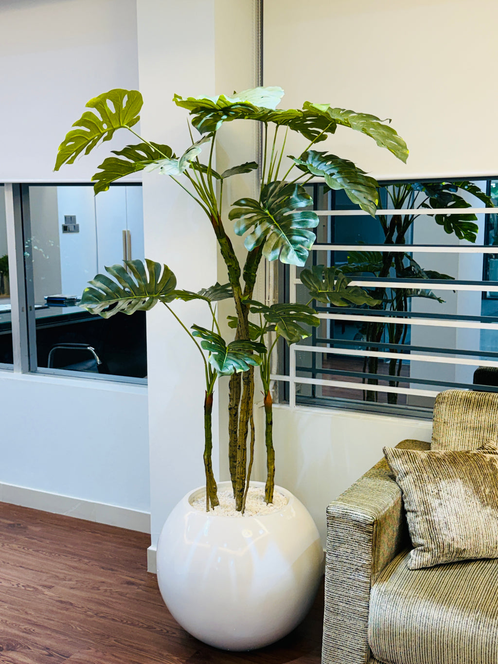 premium quality chinese imported artificial moonstera plant with lulxurious round planter and stone 6 feet+