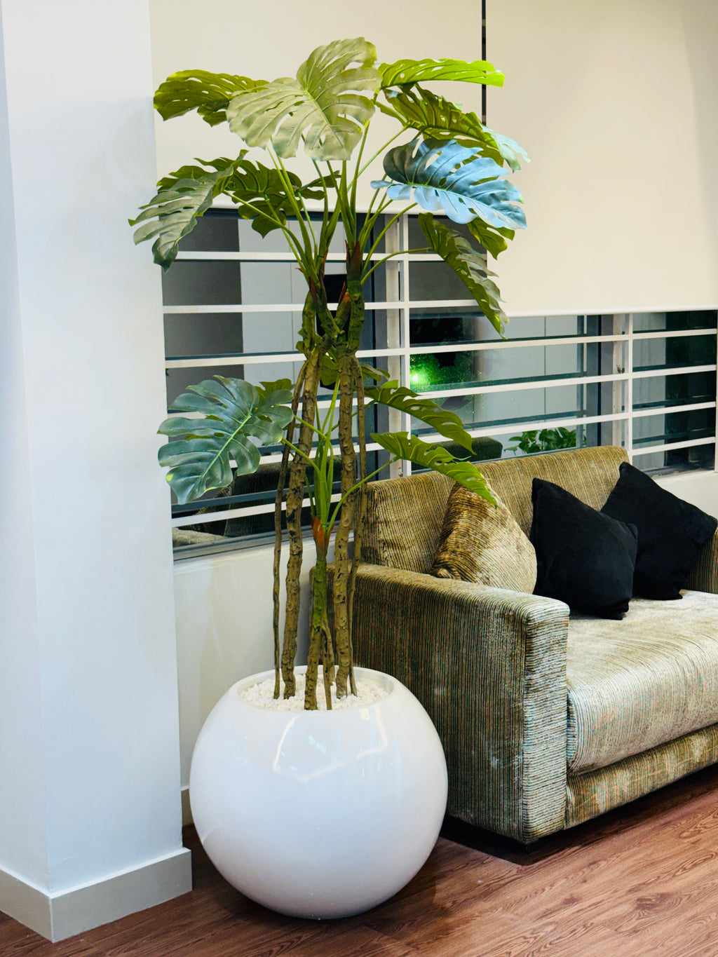 premium quality chinese imported artificial moonstera plant with lulxurious round planter and stone 6 feet+