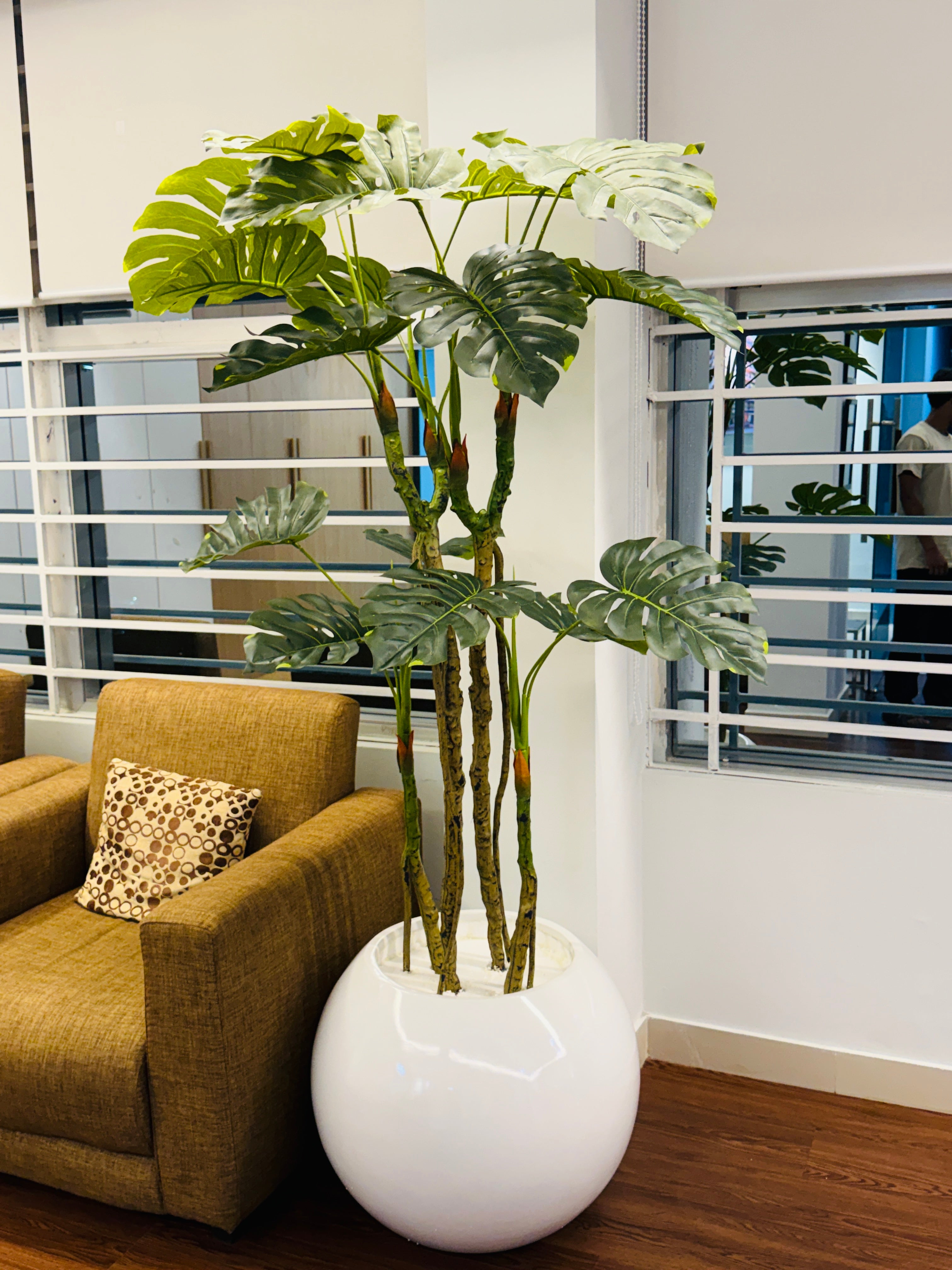 premium quality chinese imported artificial moonstera plant with lulxurious round planter and stone 6 feet+